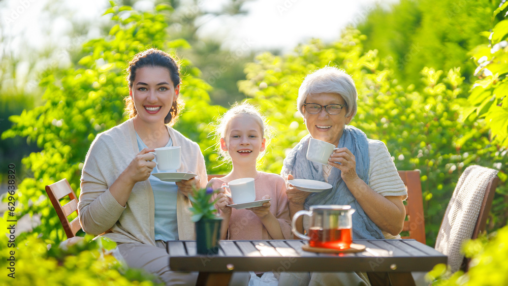 family drinking tea in the garden