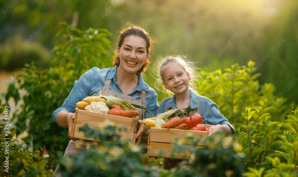 mother and daughter gardening in the backyard