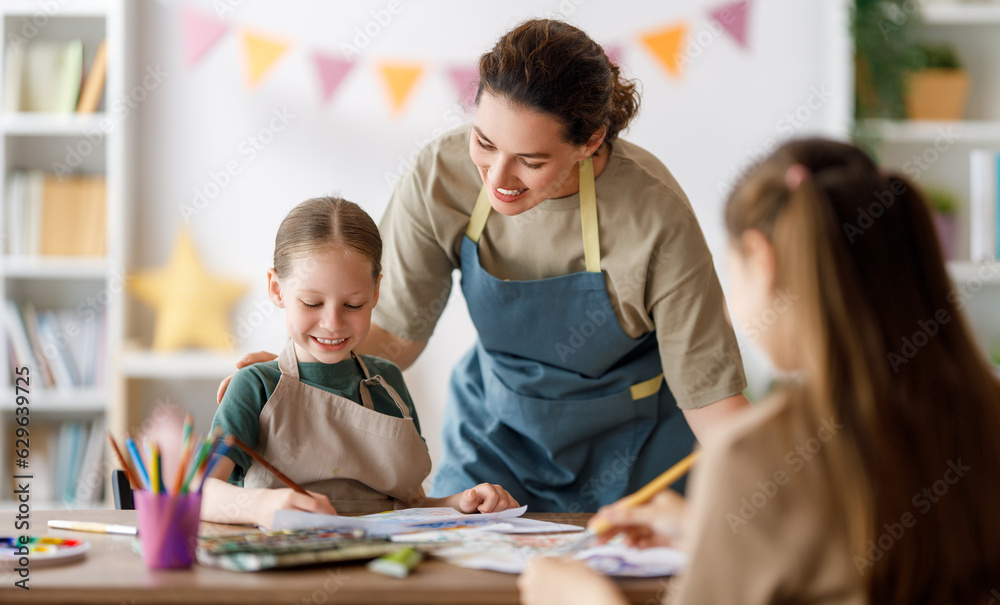 kids and teacher at the art class