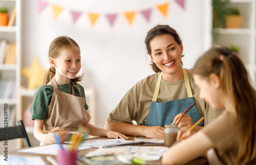 kids and teacher at the art class