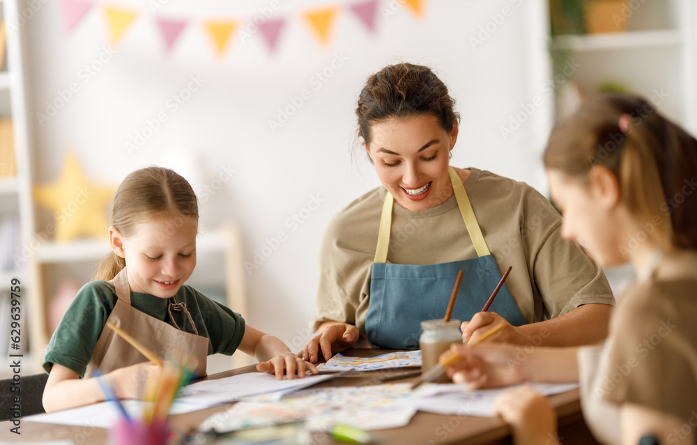 kids and teacher at the art class