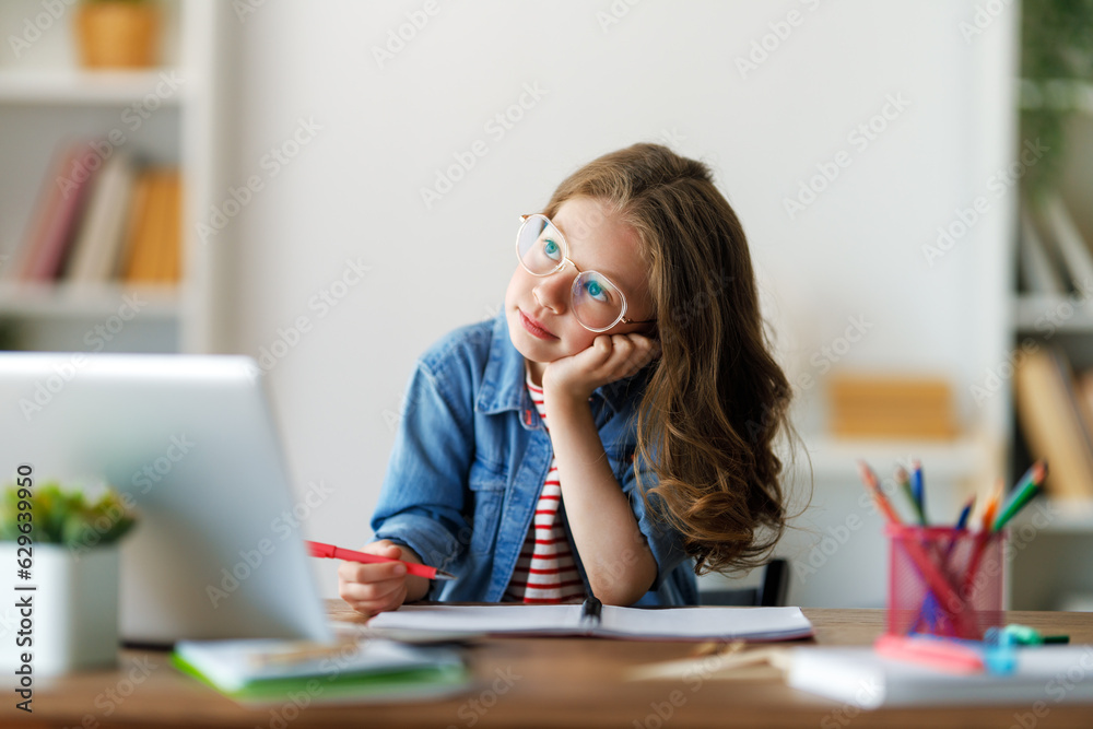 Girl doing homework or online education.