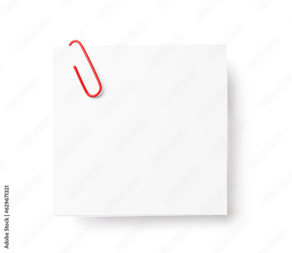 Sticky note with paper clip on white background