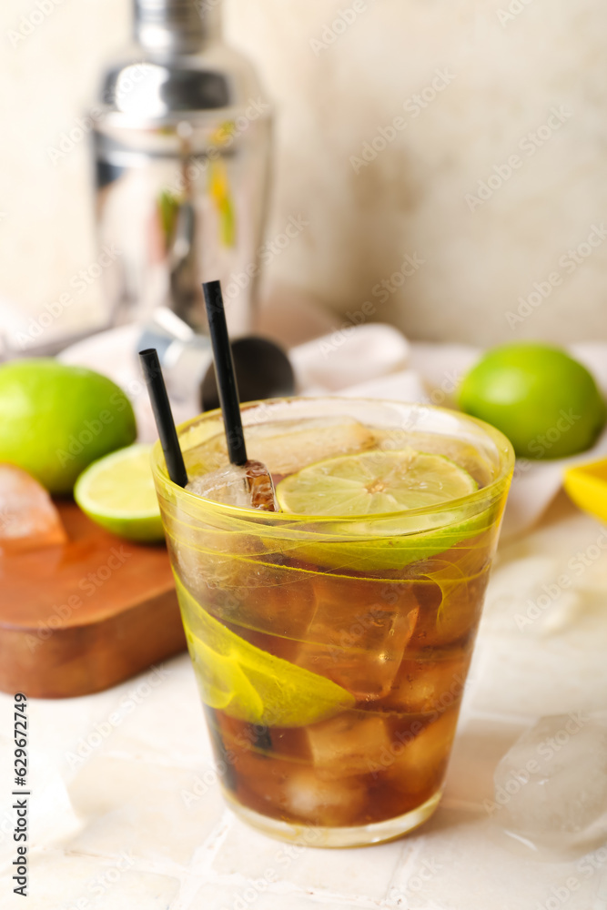 Glass of tasty Cuba Libre cocktail on table