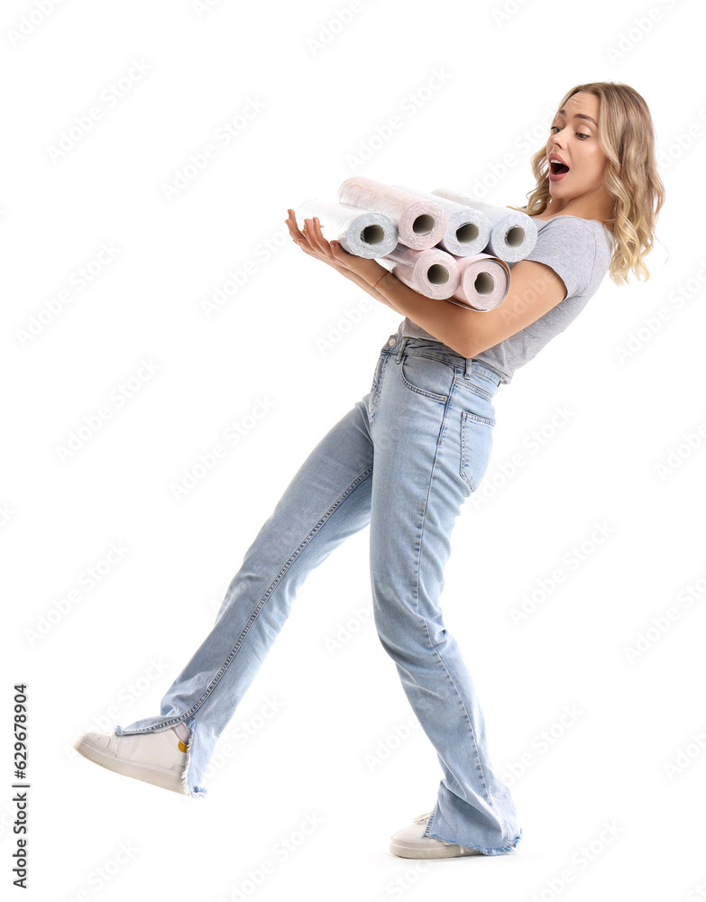 Young woman with wallpaper rolls on white background