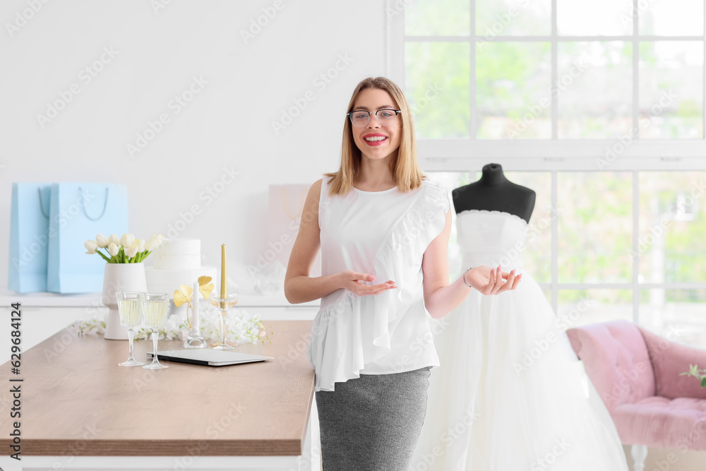 Female wedding planner working in office