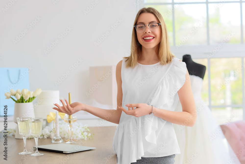 Female wedding planner working in office