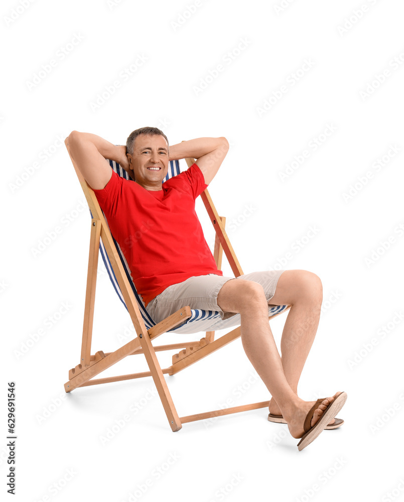 Mature man relaxing in deck chair on white background