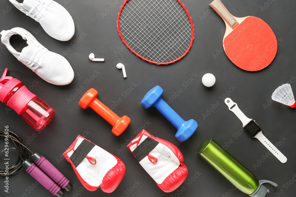 Set of sports equipment with gadgets on dark background