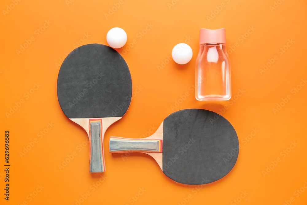 Ping pong rackets and balls on color background