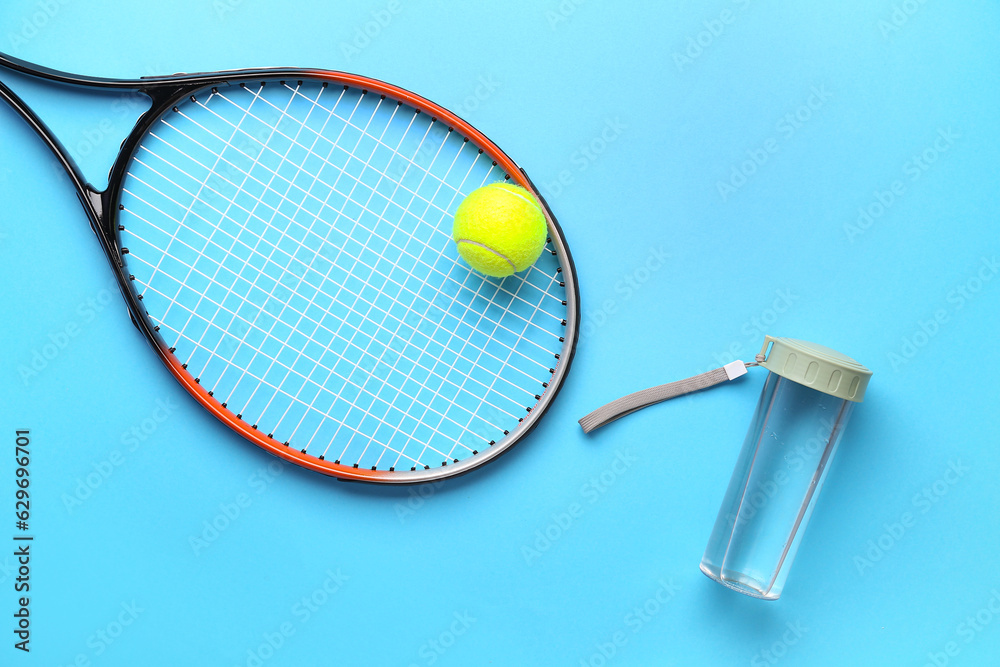 Tennis racket, ball and bottle of water on color background