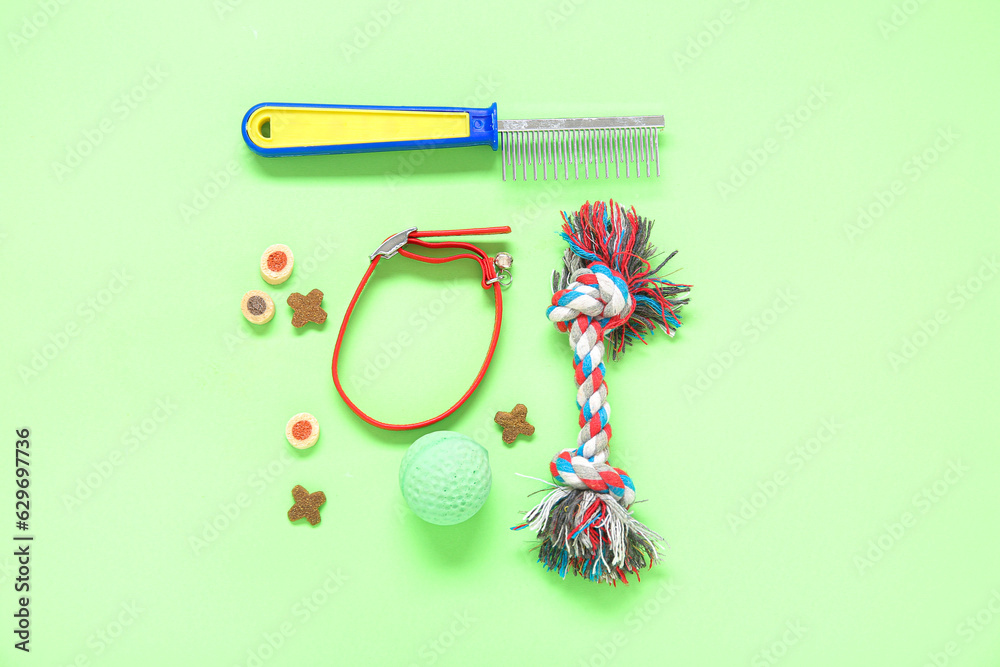 Composition with pet care accessories and food on green background