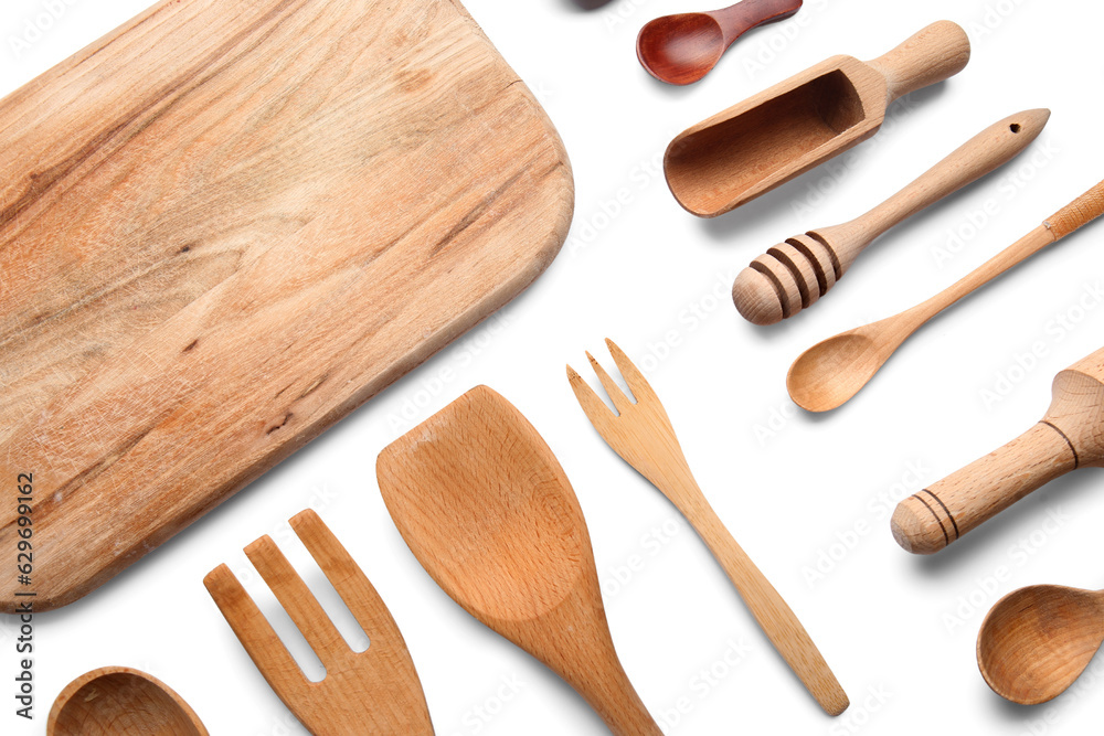 Composition with wooden kitchen utensils on white background