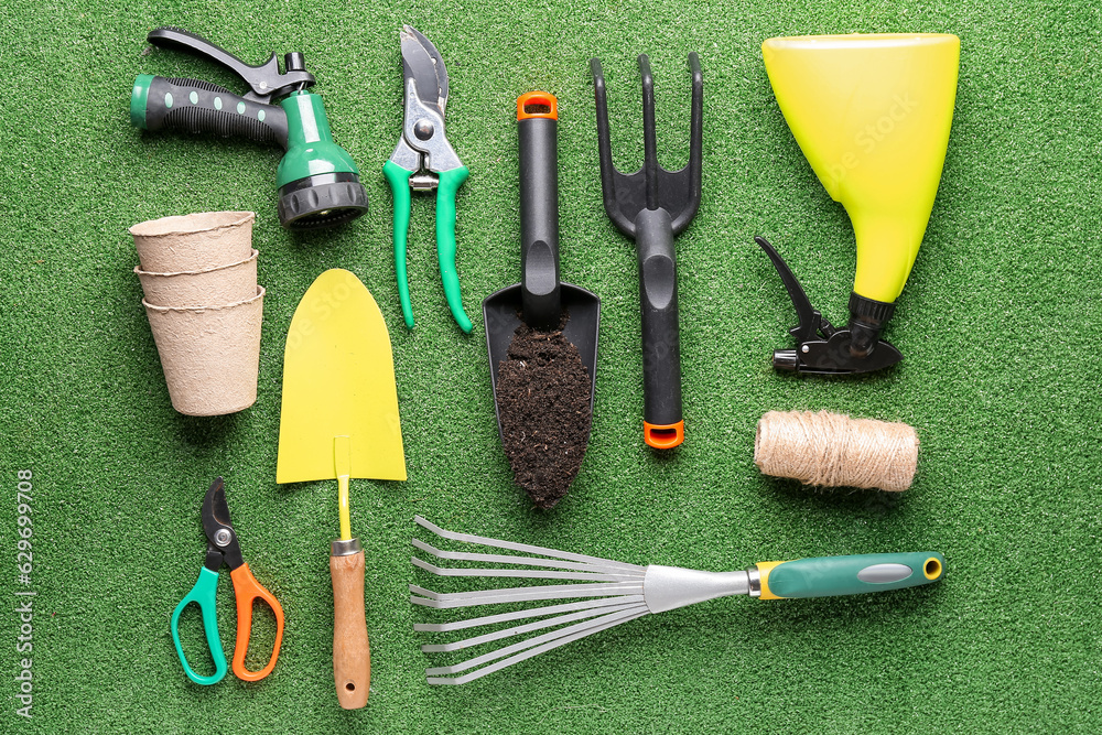 Composition with different gardening tools on color background