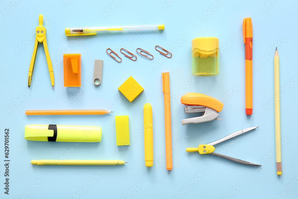 Different school stationery on blue background