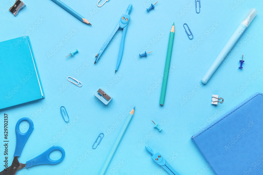 Composition with different stationery on blue background