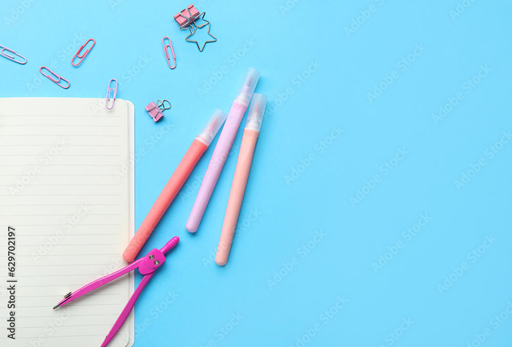 Set of different stationery on blue background