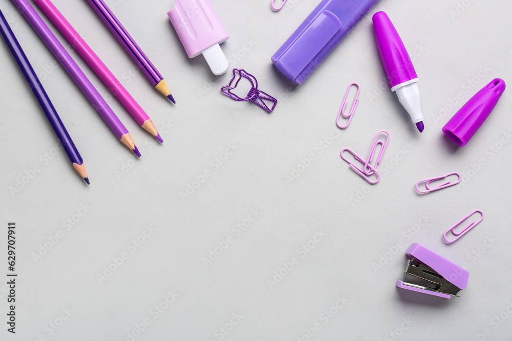 Set of different stationery with color pencils on light background