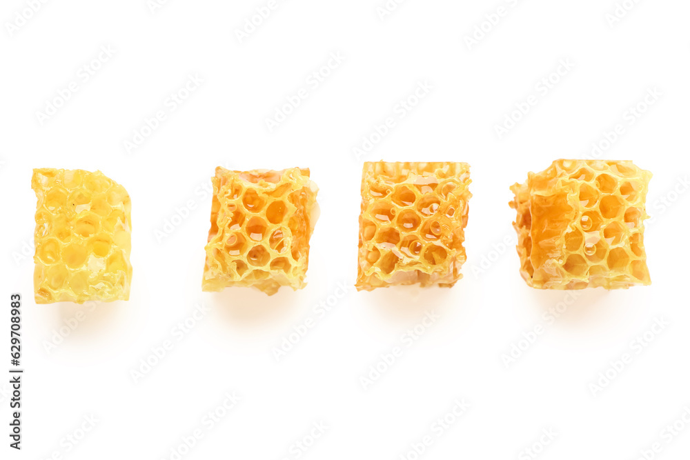 Sweet honeycombs on white background