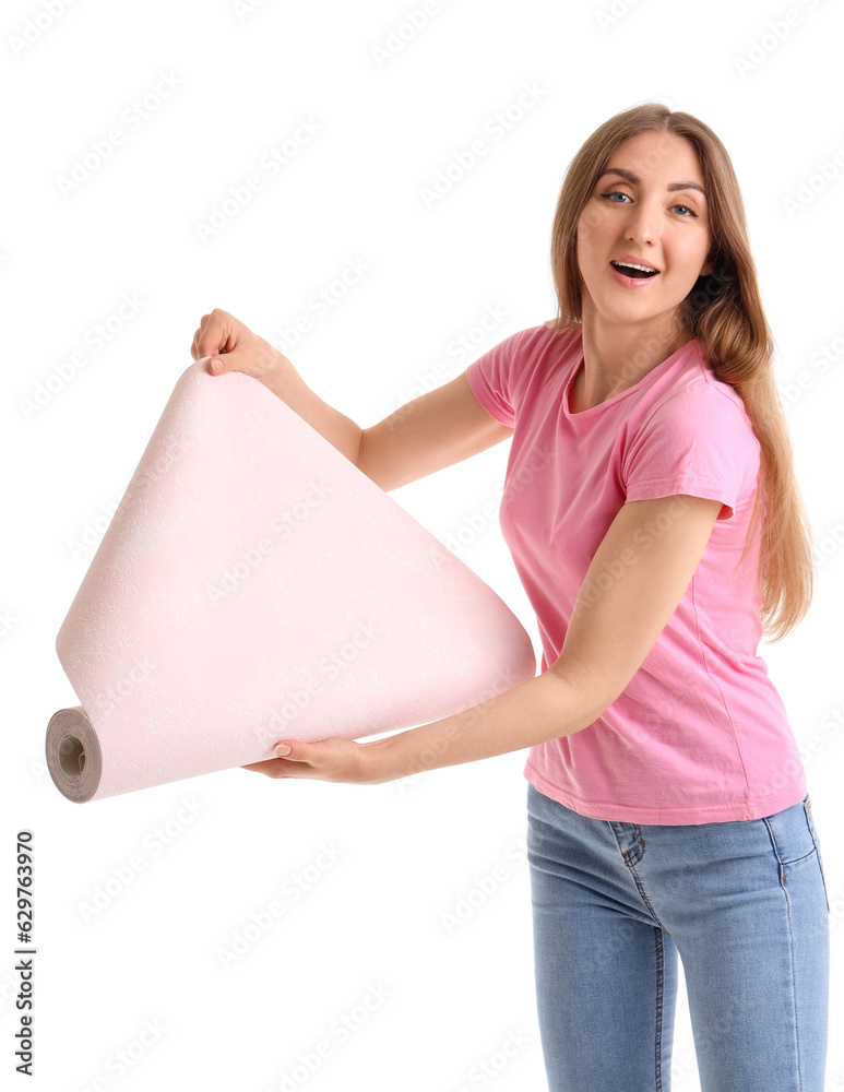 Young woman with wallpaper roll on white background