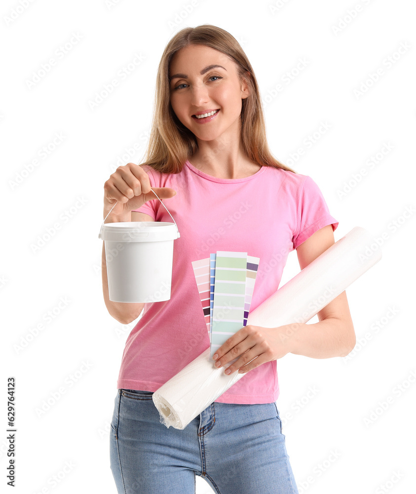 Young woman with wallpaper, color palettes and glue on white background