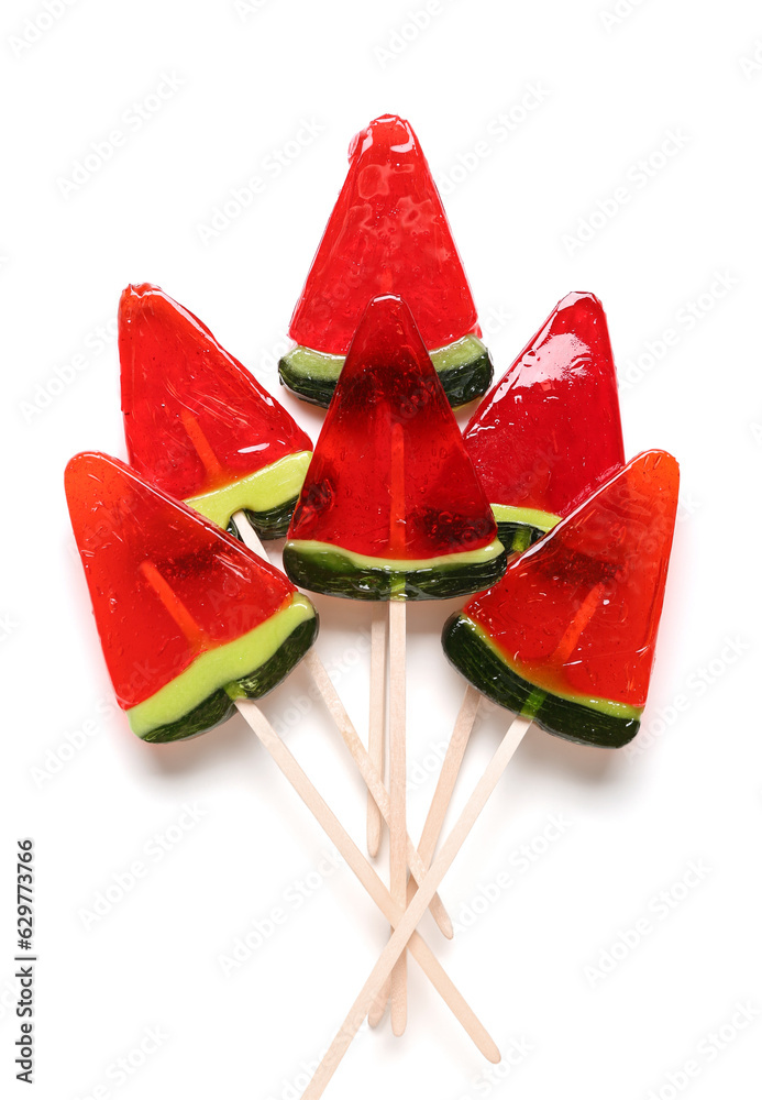 Lollipops in shape of watermelon slice on white background