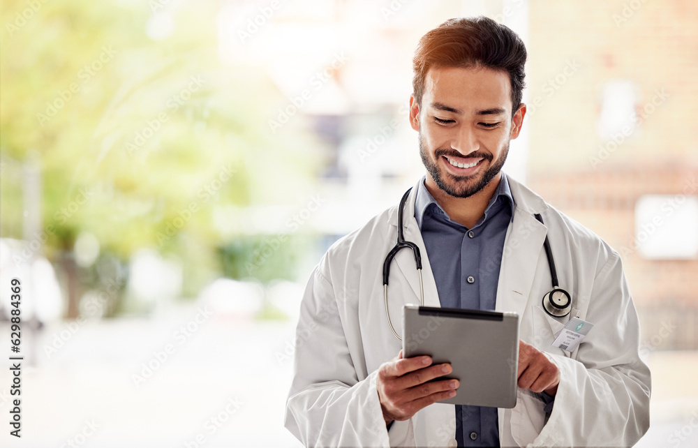 Asian man, doctor and tablet with smile in hospital for planning, research and consulting on blurred