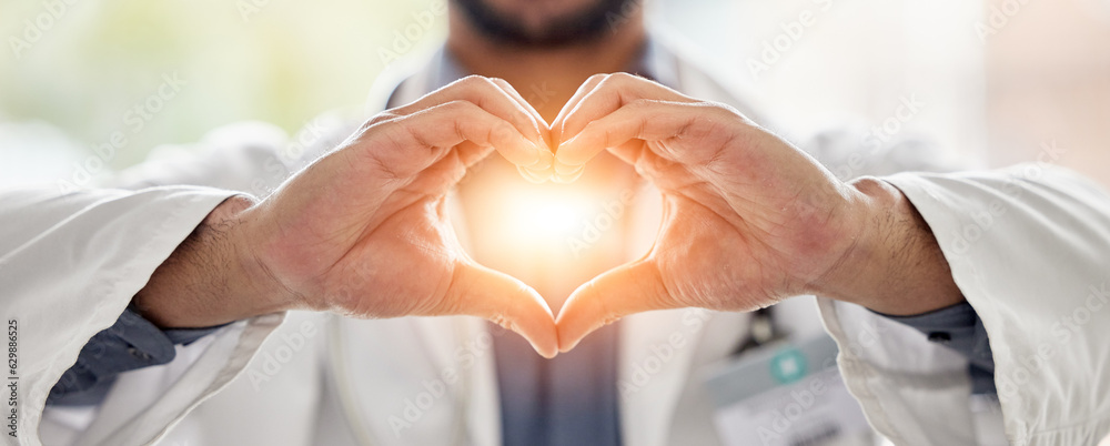 Medical, light and doctor heart hands for love, support and healthcare in a hospital or clinic by me