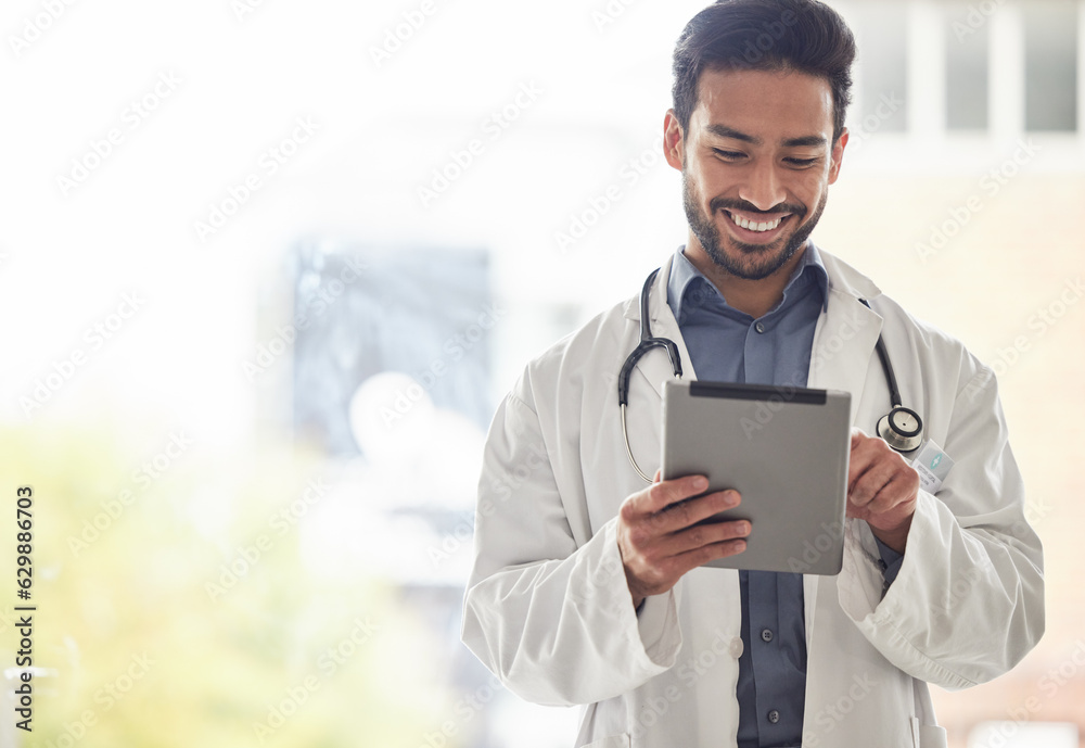 Doctor, asian man and tablet with smile in hospital for planning, research and consulting on blurred