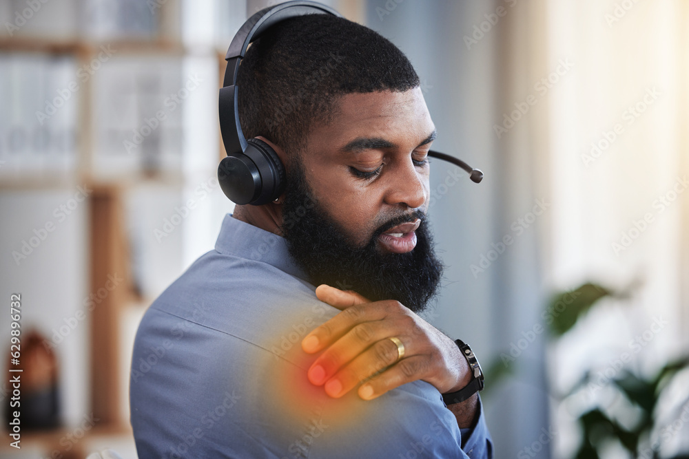 Call center, customer support and black man with shoulder pain, injury and muscle strain at desk. Te