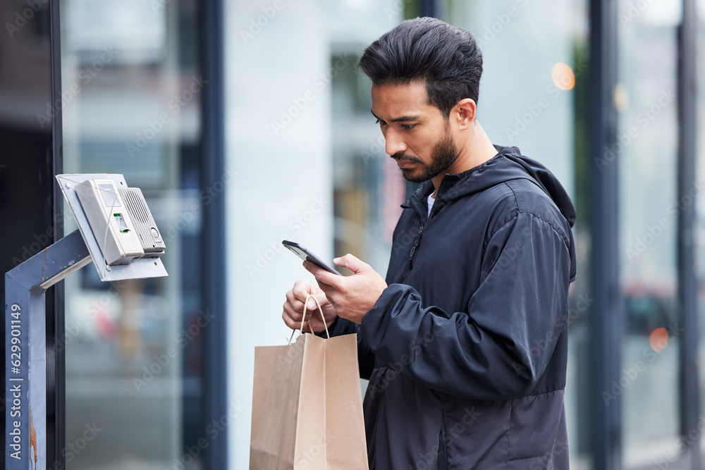 Courier man, paper bag and street with phone, typing and delivery app for service in supply chain jo