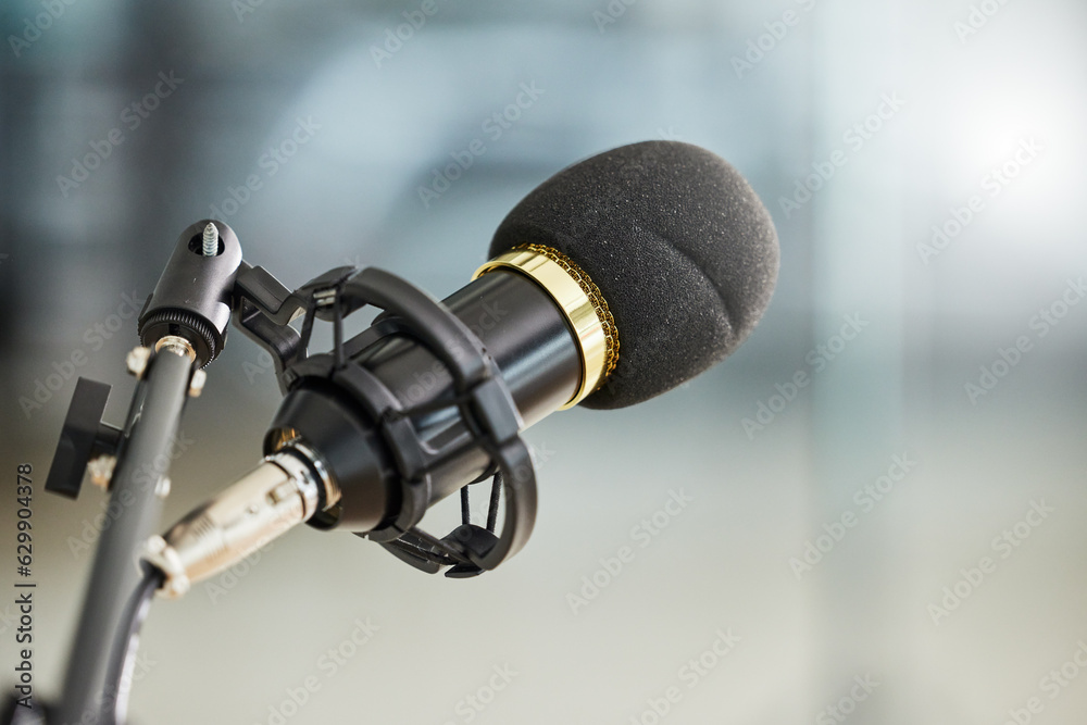 Background, closeup and microphone for podcast, radio interview and audio in recording studio. Sound