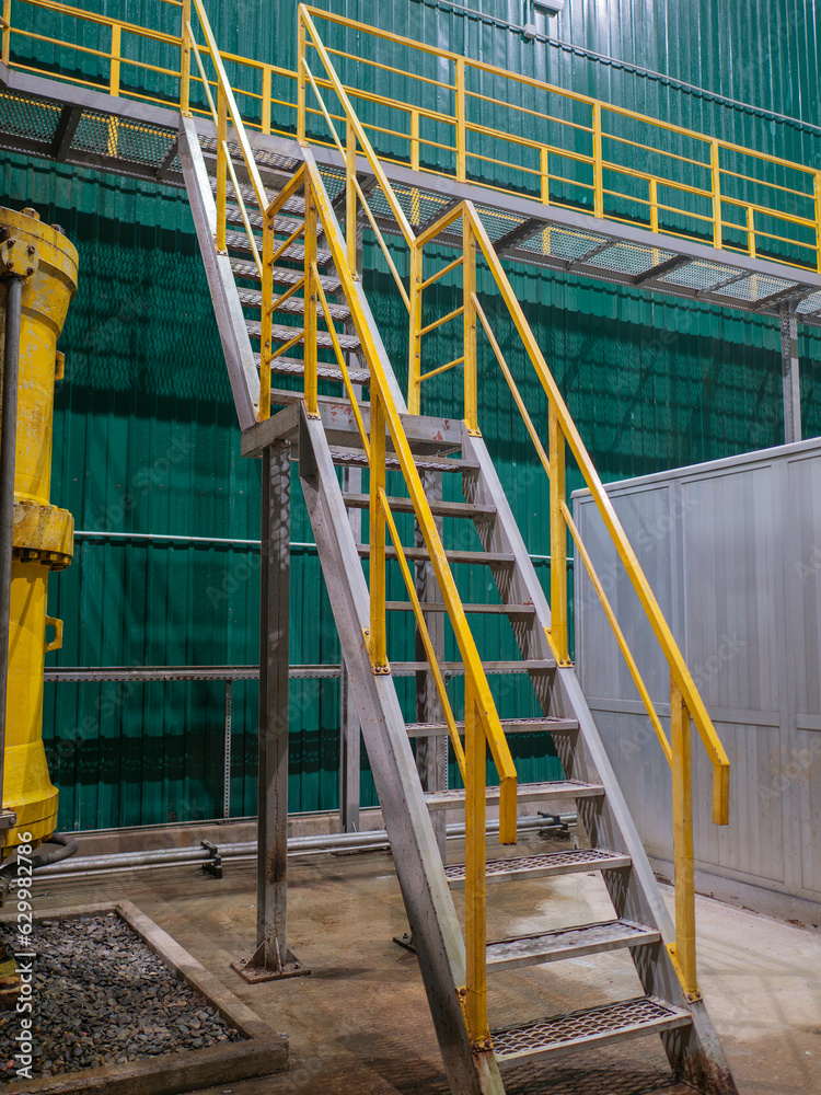 Industrial Interior, metallic colorful staircase with yellow railings