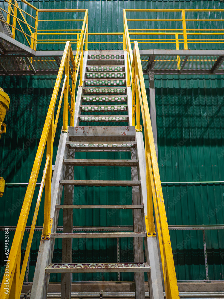 Industrial Interior, metallic colorful staircase with yellow railings