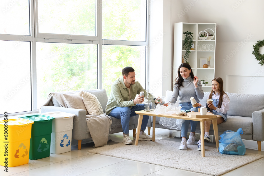 Family sorting garbage at home