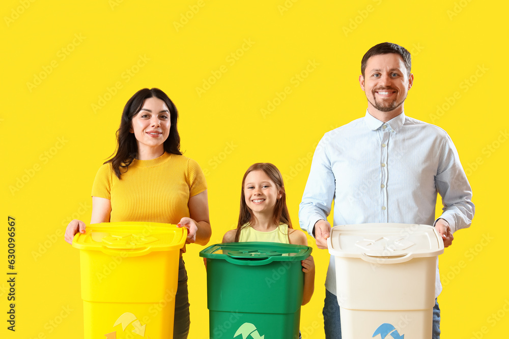 Family with recycle bins on yellow background