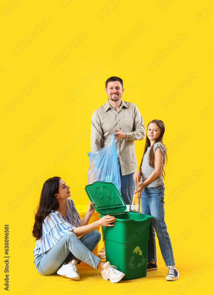 Family sorting garbage in recycle bin on yellow background