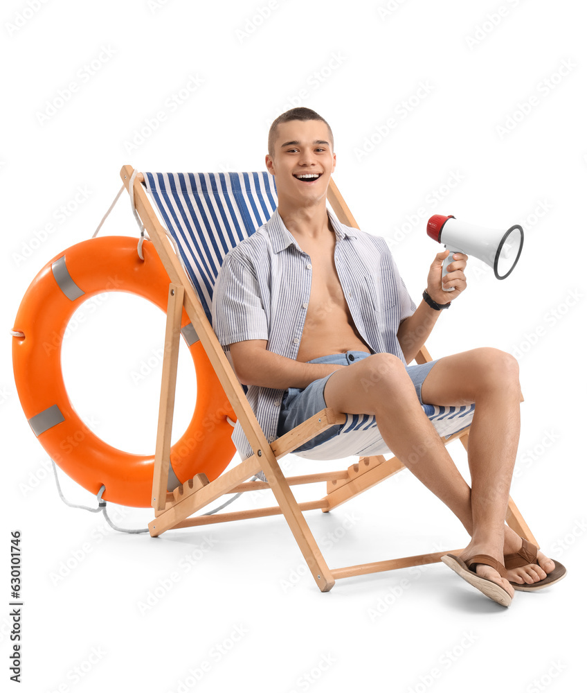 Teenage boy with megaphone in deck chair on white background