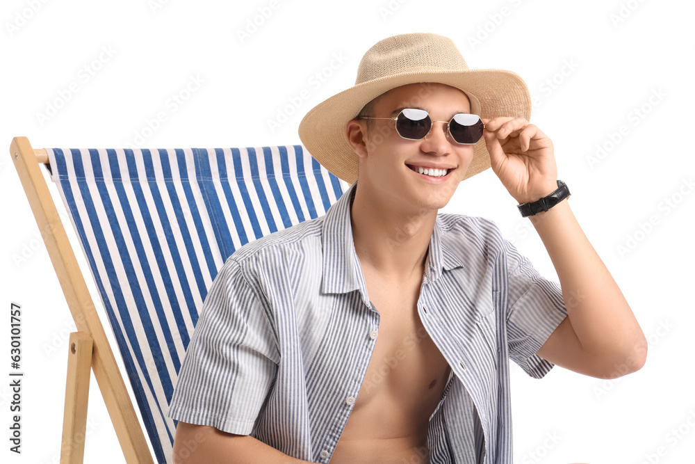 Teenage boy in deck chair on white background, closeup