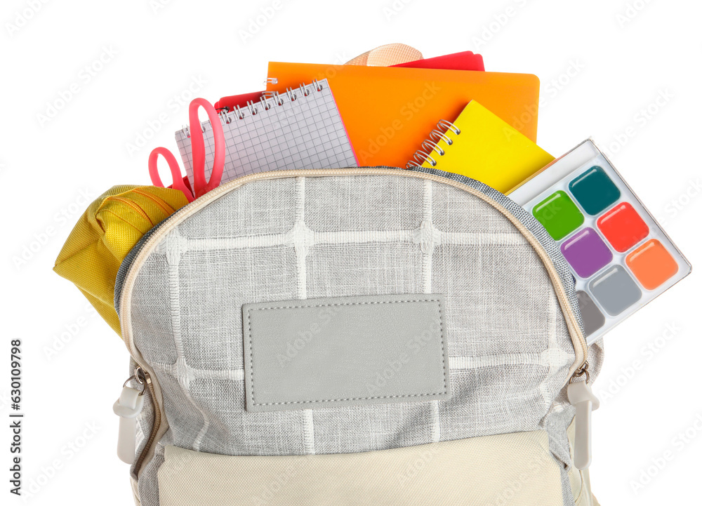 Grey school backpack with notebooks, watercolors and scissors on white background