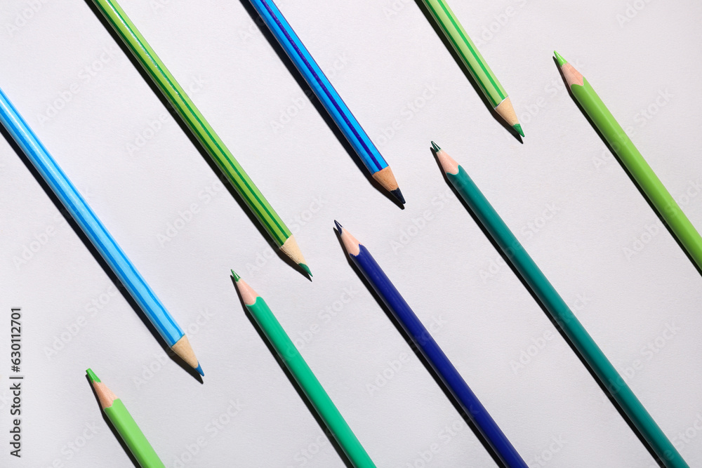 Composition with color pencils on light background