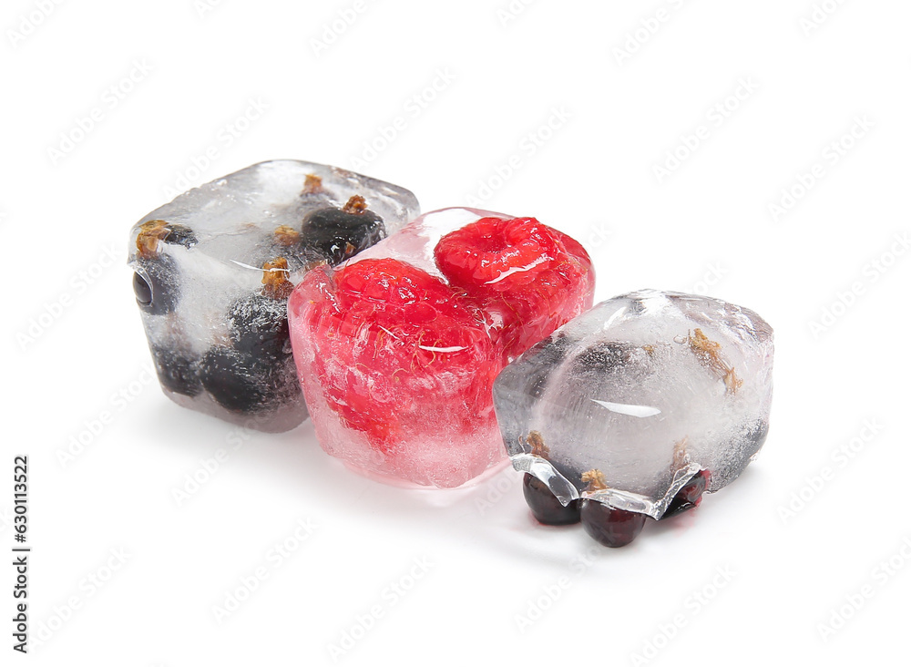 Frozen berries in ice cubes on white background