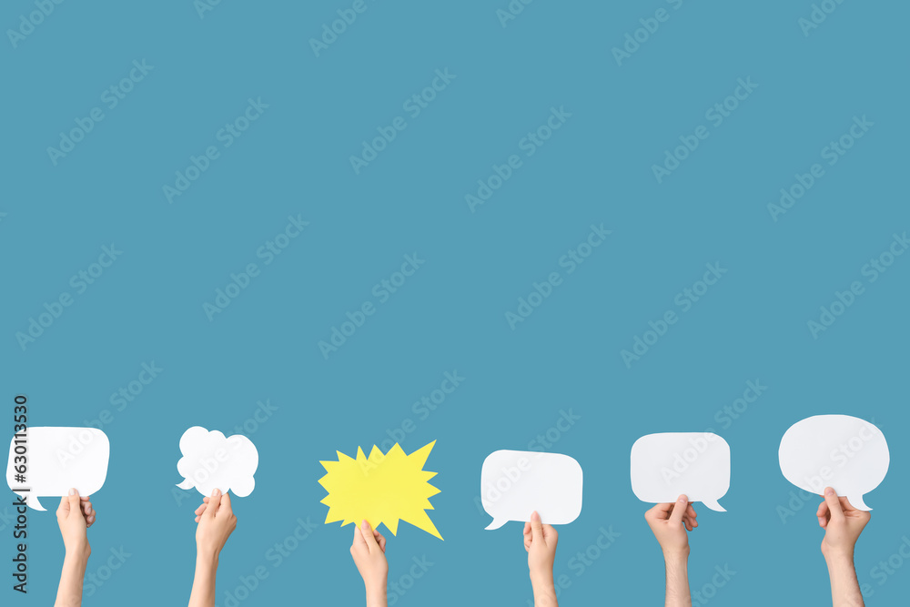 Different hands with speech bubbles on blue background