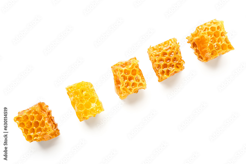 Sweet honeycombs on white background