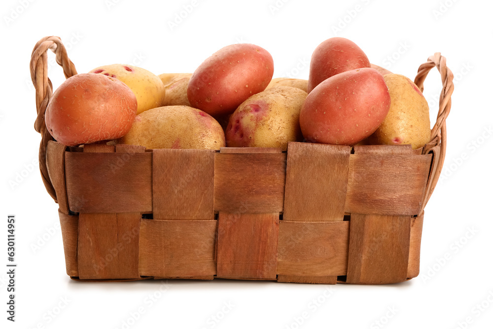 Wicker basket with fresh raw potatoes on white background