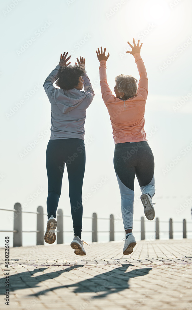 Fitness, jump and success with friends at beach for celebration, motivation and training. Cardio, wo