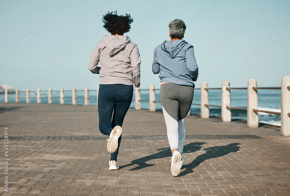 Back view, beach and friends running for fitness together as morning exercise for wellness and outdo