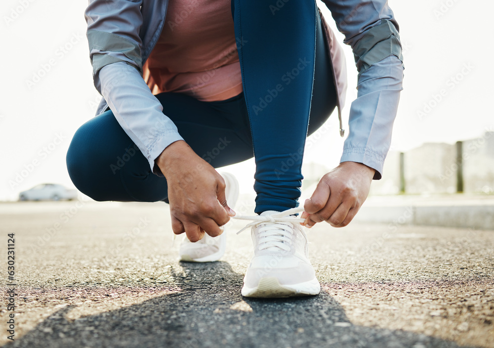 Fitness, closeup and woman tie shoes outdoor in the road for running workout in the city. Sports, he