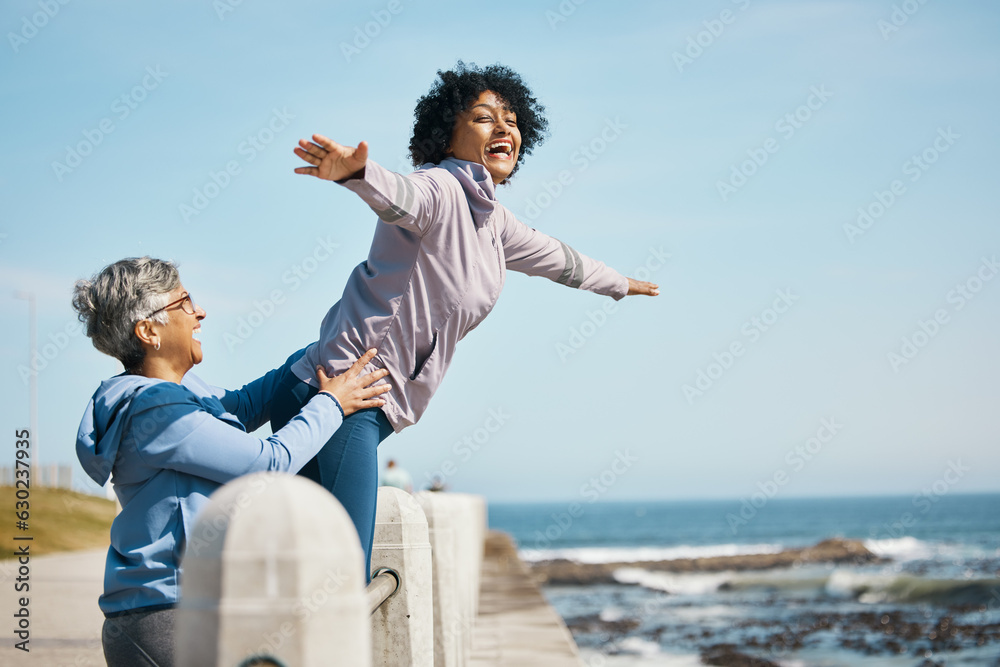 Beach, love and senior mother with woman doing airplane gesture playing, crazy and funny with parent