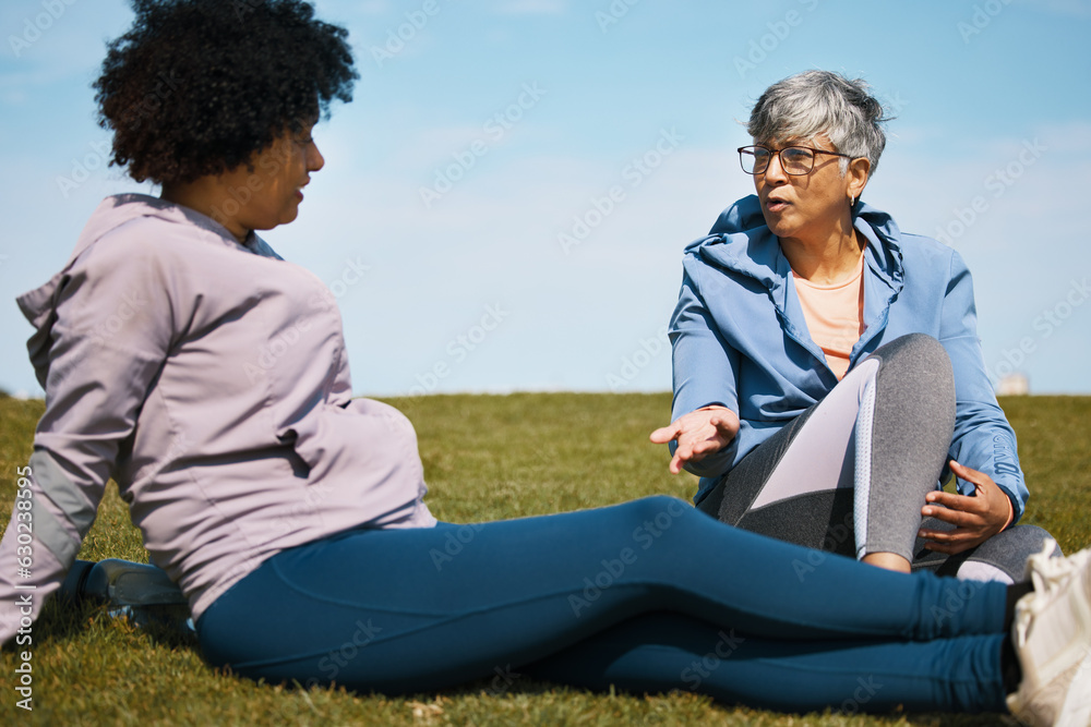 Talking, fitness and senior women friends on the grass outdoor taking a break from their workout rou